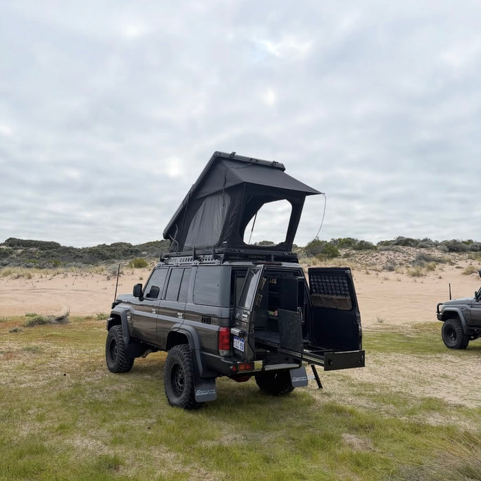 79 Series with rooftop tent set up in the dunes